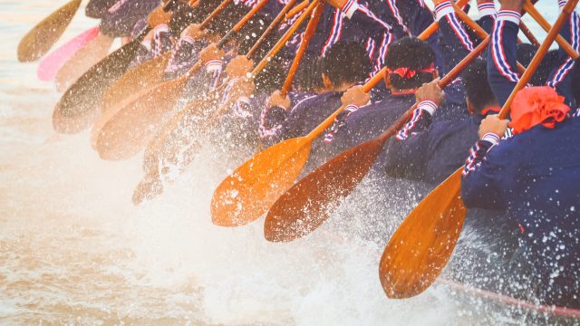 Close up of rowing team race