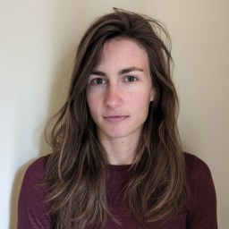 a close up of a person with long hair.