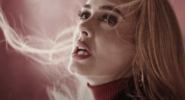 Adele singing; why sad songs make us feel good.