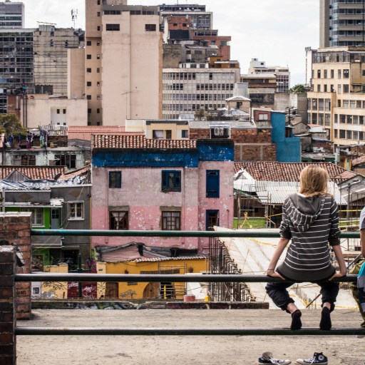 Are we close to the end of poverty? Two people look over a neighborhood in Bogota.