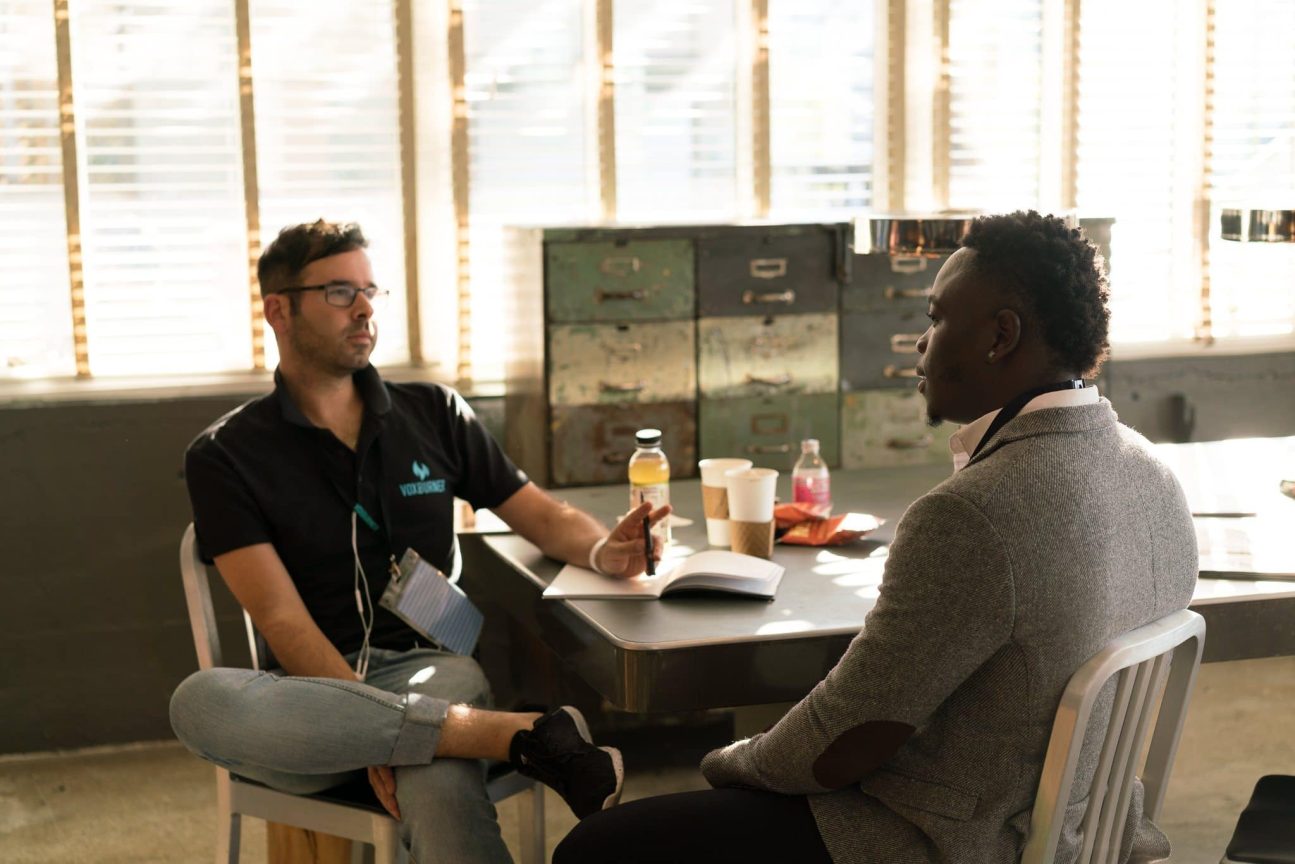 Two colleagues have a discussion.