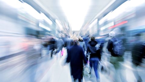 Passengers zooming by in subway.