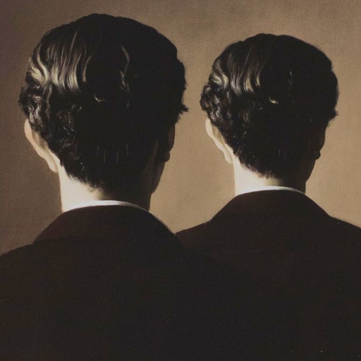 A man in a suit stands facing a mirror, but the reflection shows the back of his head instead of his face.