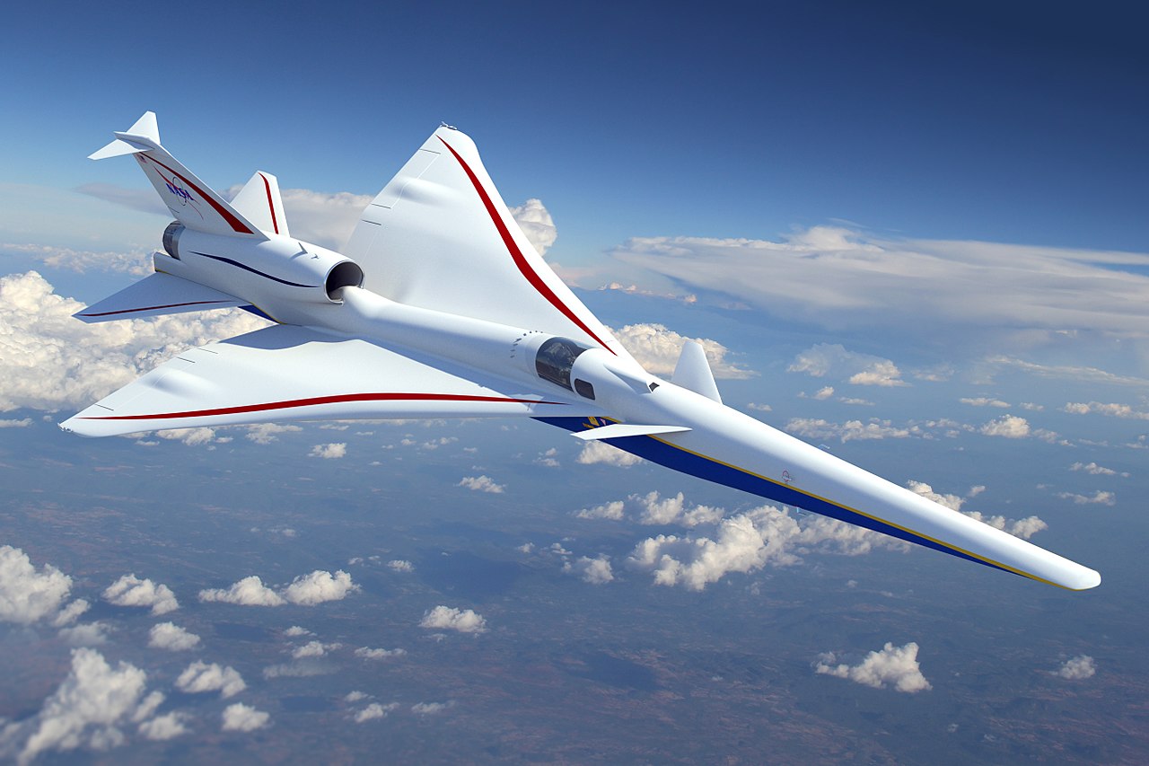 a white jet flying through a blue cloudy sky.