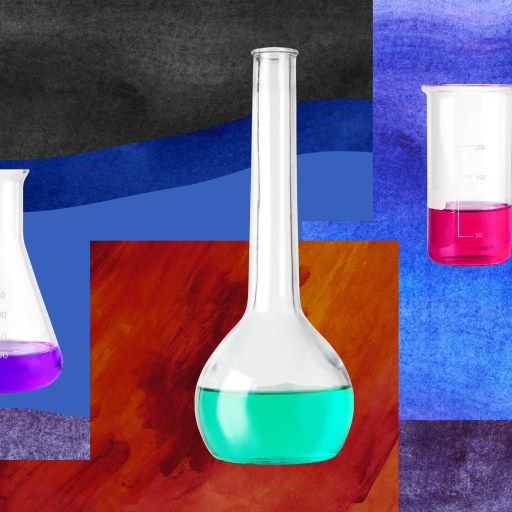three test tubes with colored liquids in them.