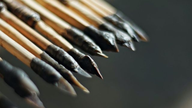 a close up of a bunch of wooden sticks.