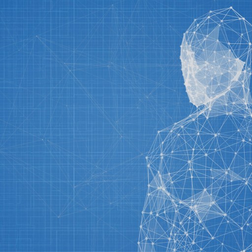 a person standing in front of a blue background.