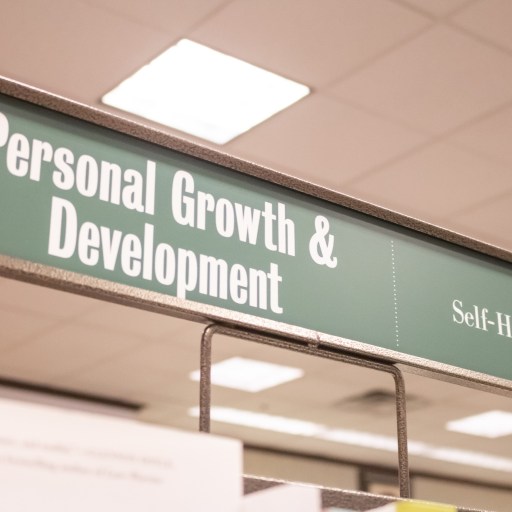 a sign that says personal growth and development.