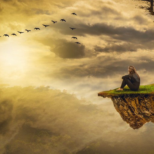 a man sitting on top of a small island.