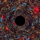 a black hole in the center of a space filled with stars.