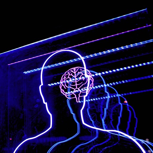 a man's head is projected in blue light.