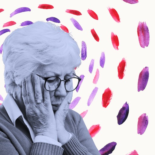 an older woman with glasses is covering her face.