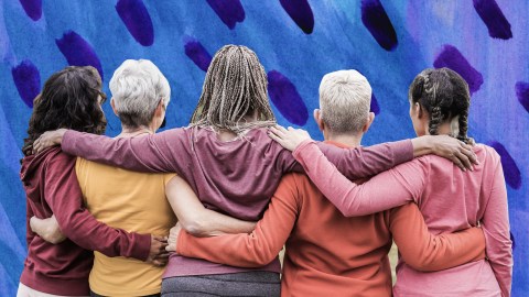 a group of women standing next to each other.