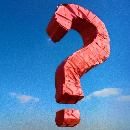 a red question mark kite flying in the sky.