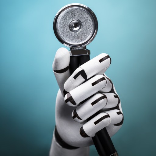 a robot hand holding a magnifying glass.