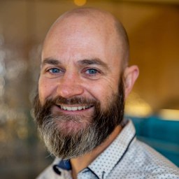a close up of a person wearing a shirt and tie.