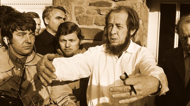 a group of men standing next to each other.