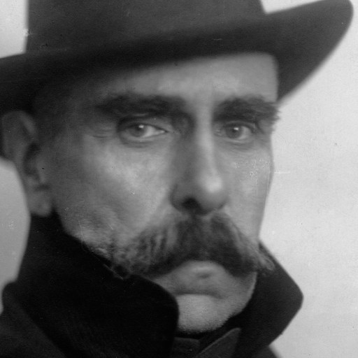 a black and white photo of a man with a mustache.