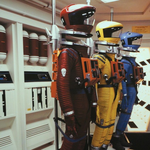 a room with a bunch of different types of helmets on display.