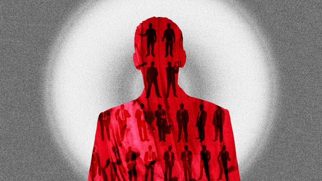 a man standing in front of a white light.