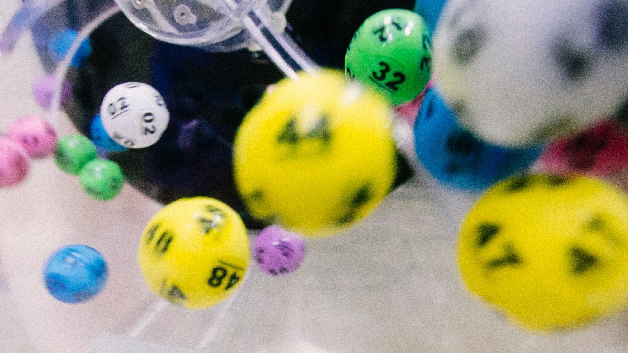 Lottery balls moving in a spinner.