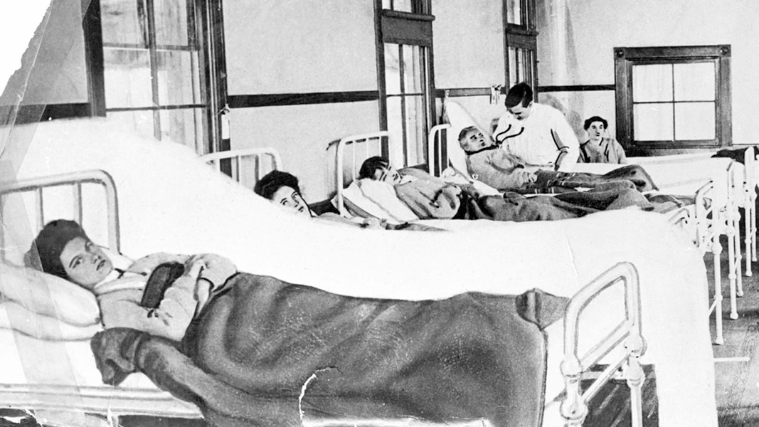 a black and white photo of a group of people in a hospital.