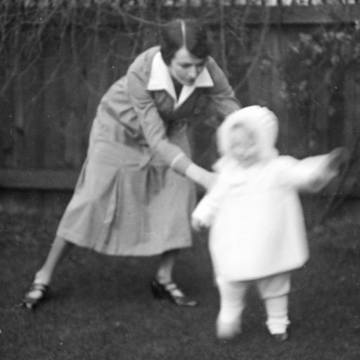 a black and white photo of a woman and a child.
