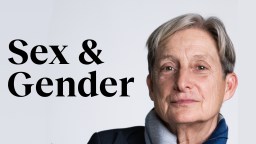 a woman with grey hair and a blue jacket.
