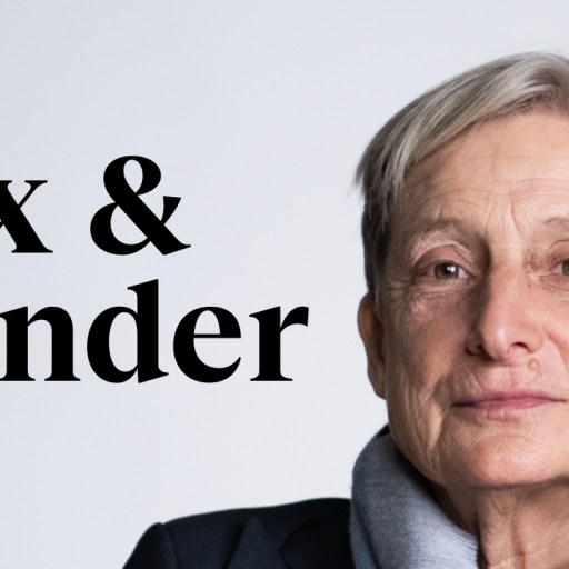 a woman with grey hair and a blue jacket.