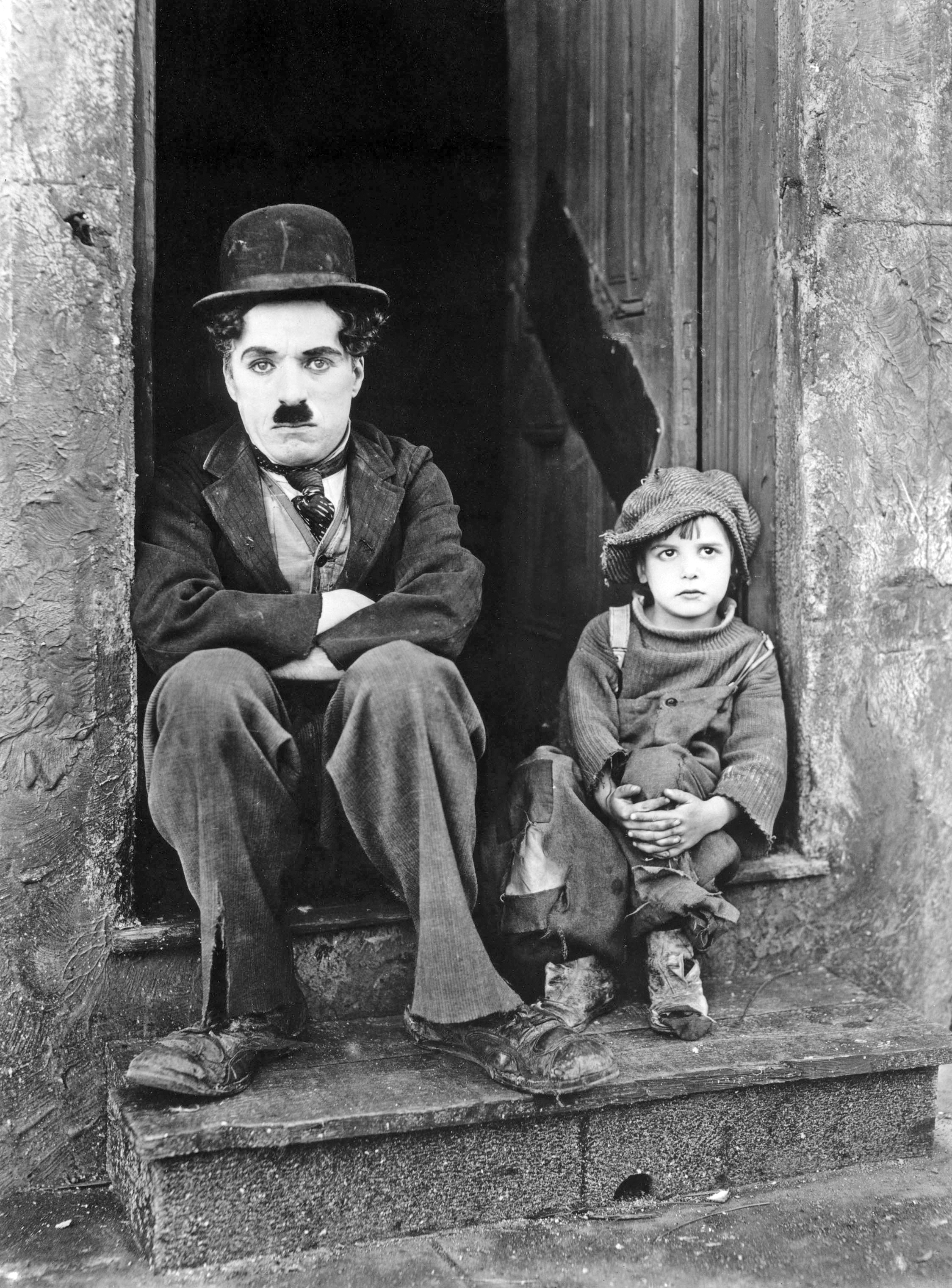 a black and white photo of a man and a child.