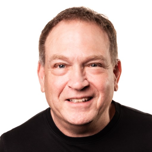 a close up of a person wearing a black shirt.