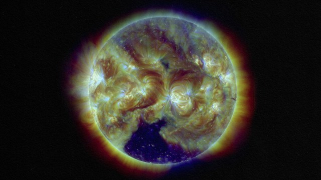 a close up of the sun with a black background.
