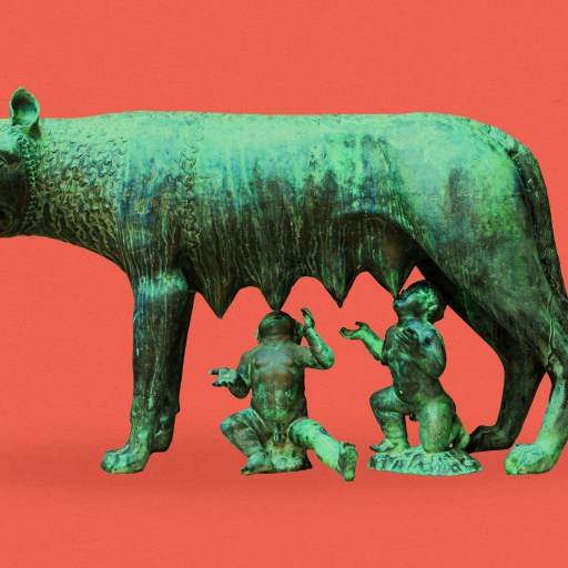 a bronze statue of a wolf and two children.