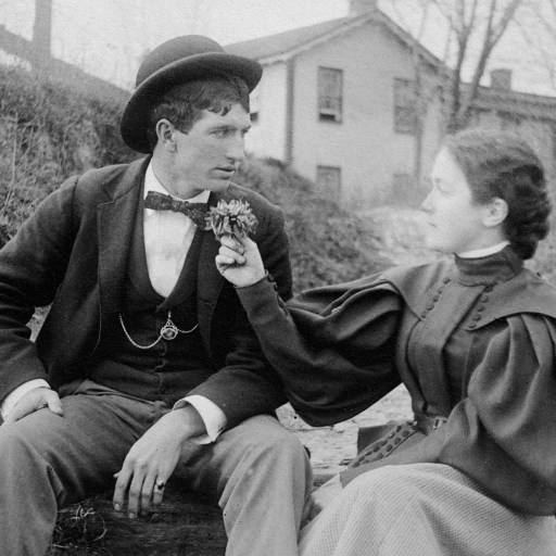 A man and woman reconciling on a log.