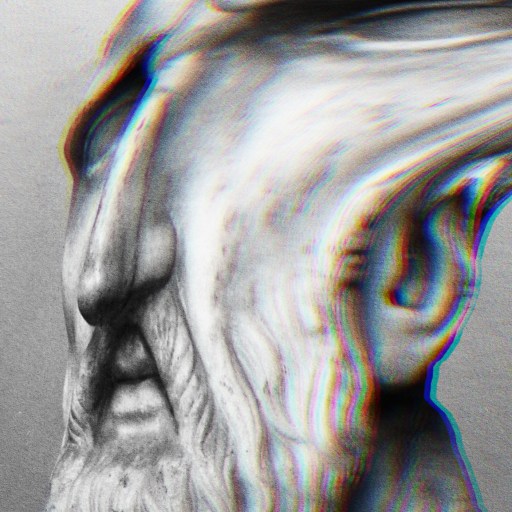 A stoic man with a beard in a black and white photo.