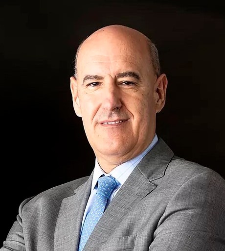 A bald man in a suit and tie.