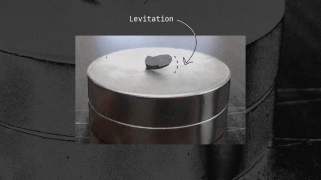 A black and white photo of a metal barrel with an lk-99 arrow pointing to it.