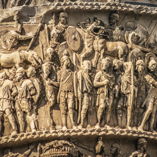 A statue of a man on a column, reflecting the history of pants.