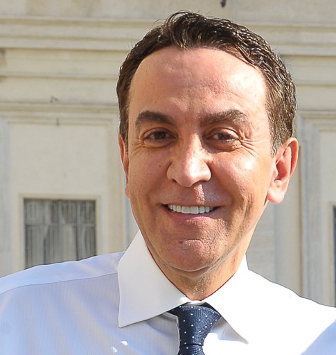 A man wearing a white shirt.