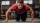 A man doing push ups in a gym.