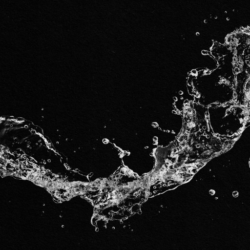 A squirting water splash on a black background.