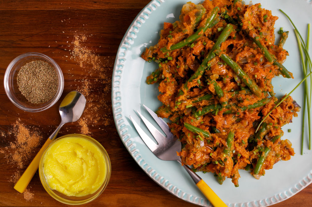 A plate with vegetables and sauce on it.