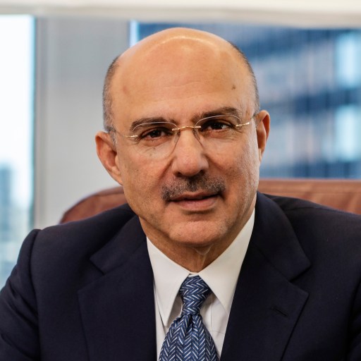 A bald man in a suit and tie.