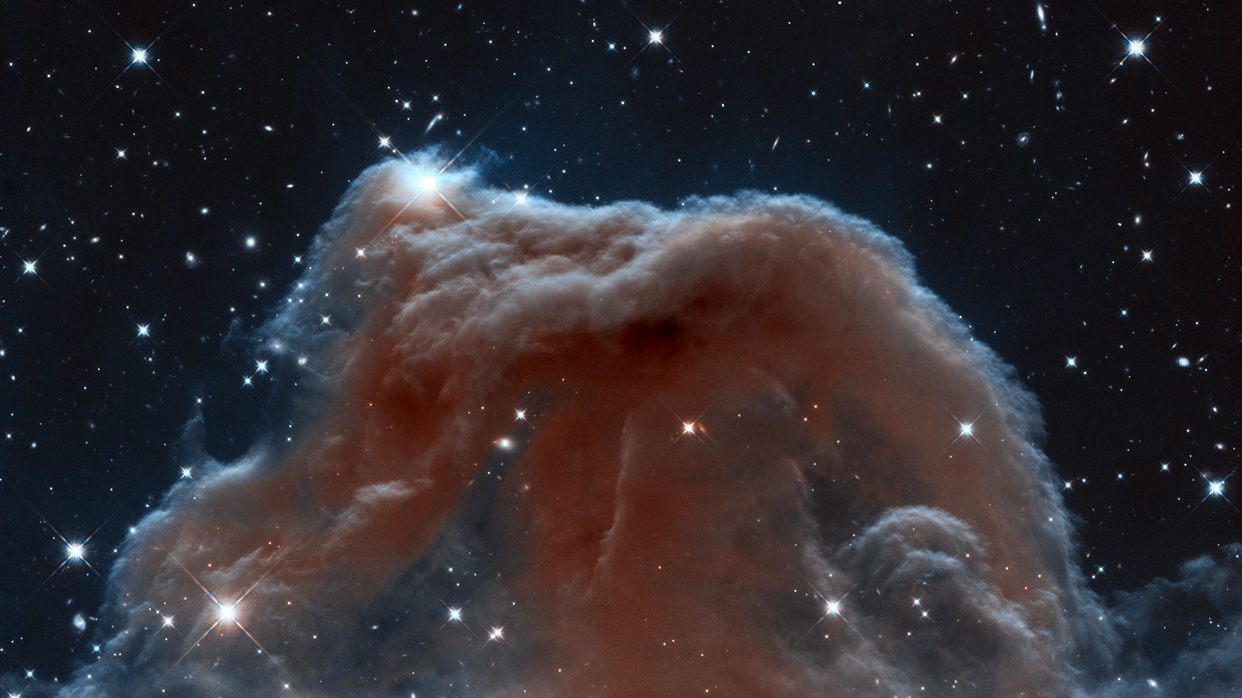 An image of a nebula surrounded by stars, fine-tuned for life within its cosmic expanse.