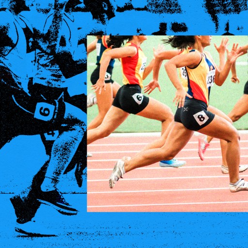 A group of people running on a track.