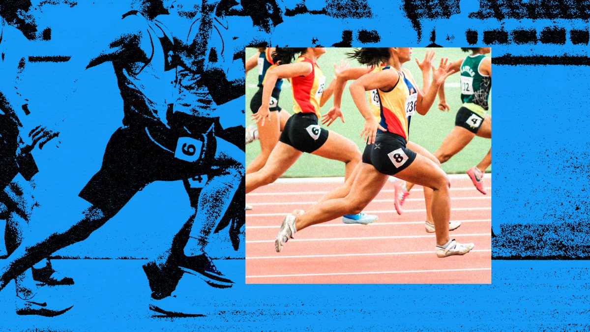A group of people running on a track.