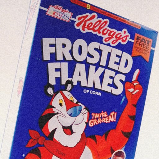 A box of processed kellogs frosted flakes.