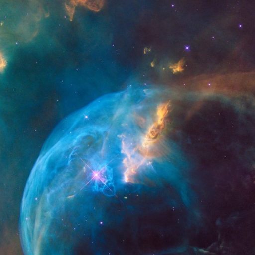 An image of a blue nebula in space.