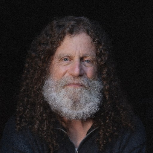 A man with long hair and a beard, embodying the concept of free will.