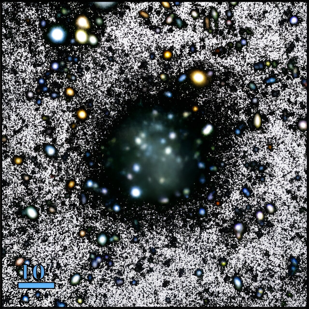 An image of a dark black hole in space.